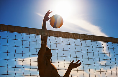 Buy stock photo Volleyball, fitness and man at beach with ball serve, energy or freedom on blue sky background. Seaside, sports or male player with handball in nature for cardio, workout or athletic game performance