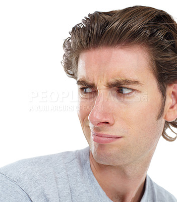 Buy stock photo Young man, disgust and face looking over shoulder with anger, confused or frown against a white studio background. Isolated male model with annoyed, angry or funny facial expression and smirk