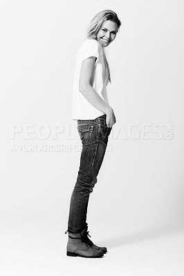 Buy stock photo Portrait, smile and fashion with a monochrome woman in studio on a white background for casual style. Model, happy or natural with a confident young person in black and white to wear trendy clothes