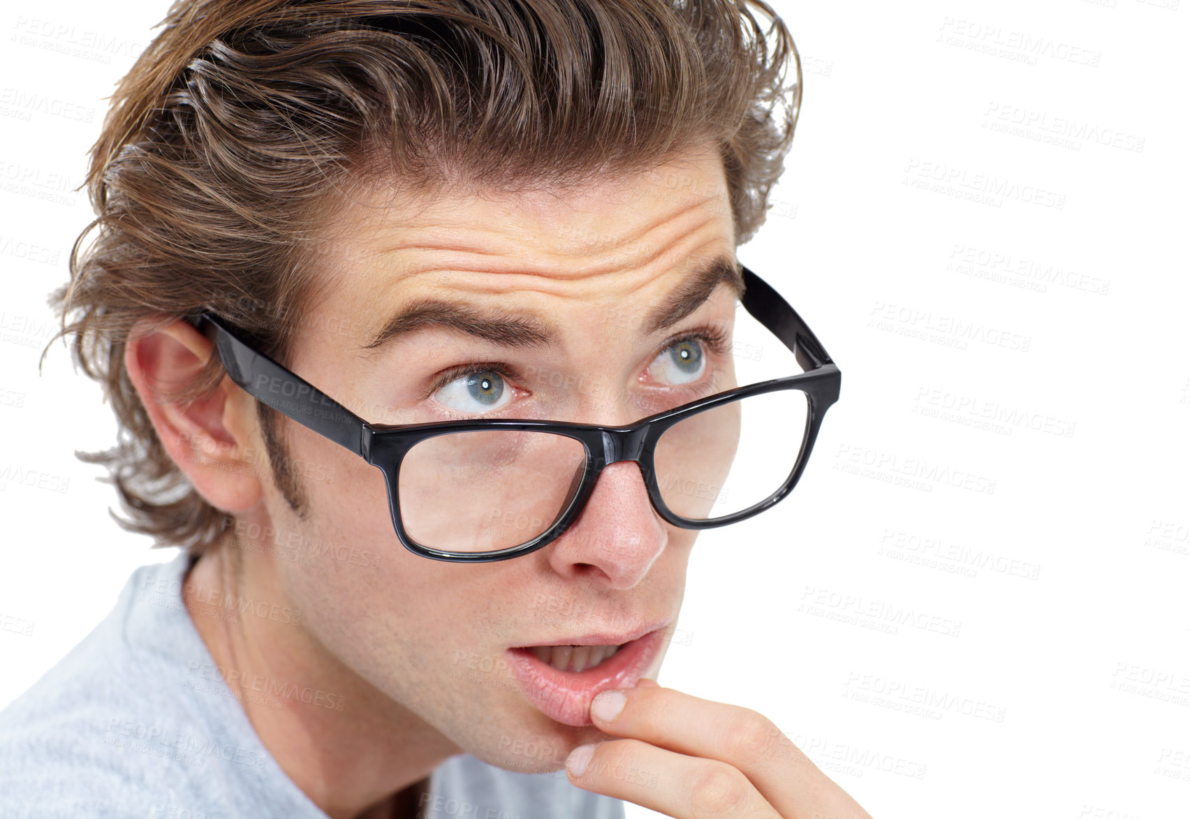 Buy stock photo Young man wearing glasses touching his lip and looking pensive