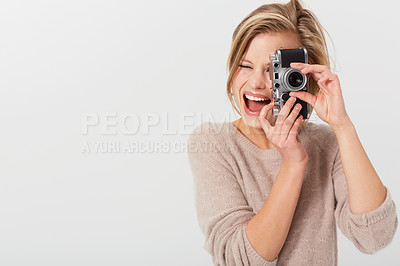 Buy stock photo A young woman taking a picture of you alongside copyspace