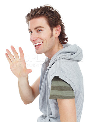 Buy stock photo Happy, casual and man waving in a studio for greeting with a stylish and trendy outfit. Happiness, smile and male model with fashion or style doing a hello hand gesture isolated by a white background