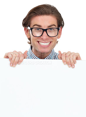 Buy stock photo Portrait, happy and man with poster for mockup in studio isolated on a white background. Board, glasses and funny male person, geek or nerd with copy space for advertising, marketing or promotion.