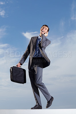 Buy stock photo Happy business man, phone call and sky with briefcase for mobile contact, communication and corporate connection. Male employee walking by clouds, talking on smartphone and mockup networking with bag