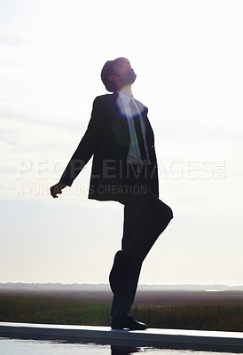 Buy stock photo Dance, sky and freedom of man in suit and silhouette whistle with energy, dancing and happiness in nature. Dancer, happy and male person in professional clothes on mockup background for performance