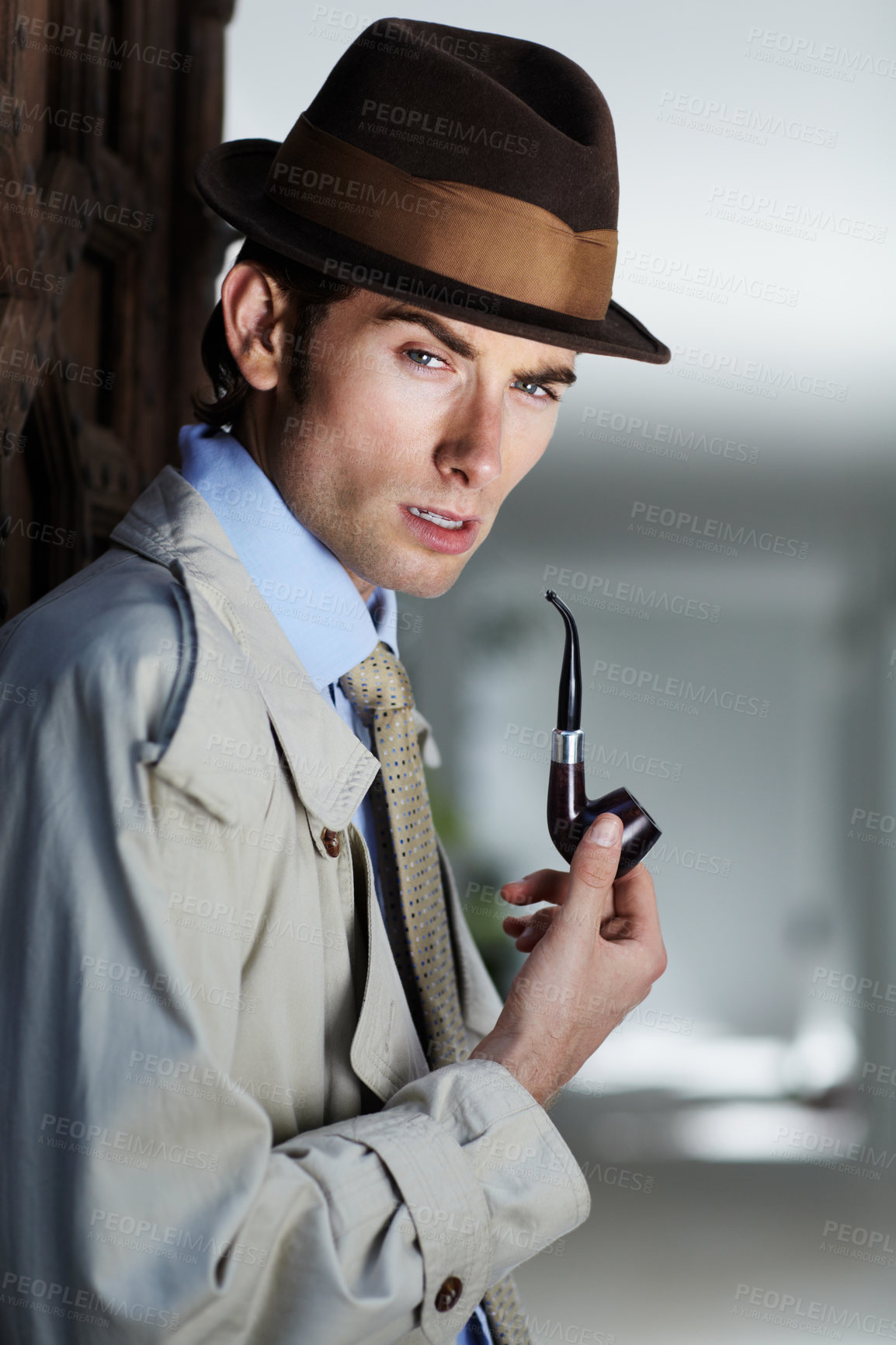 Buy stock photo Thoughtful private investigator smoking his pipe