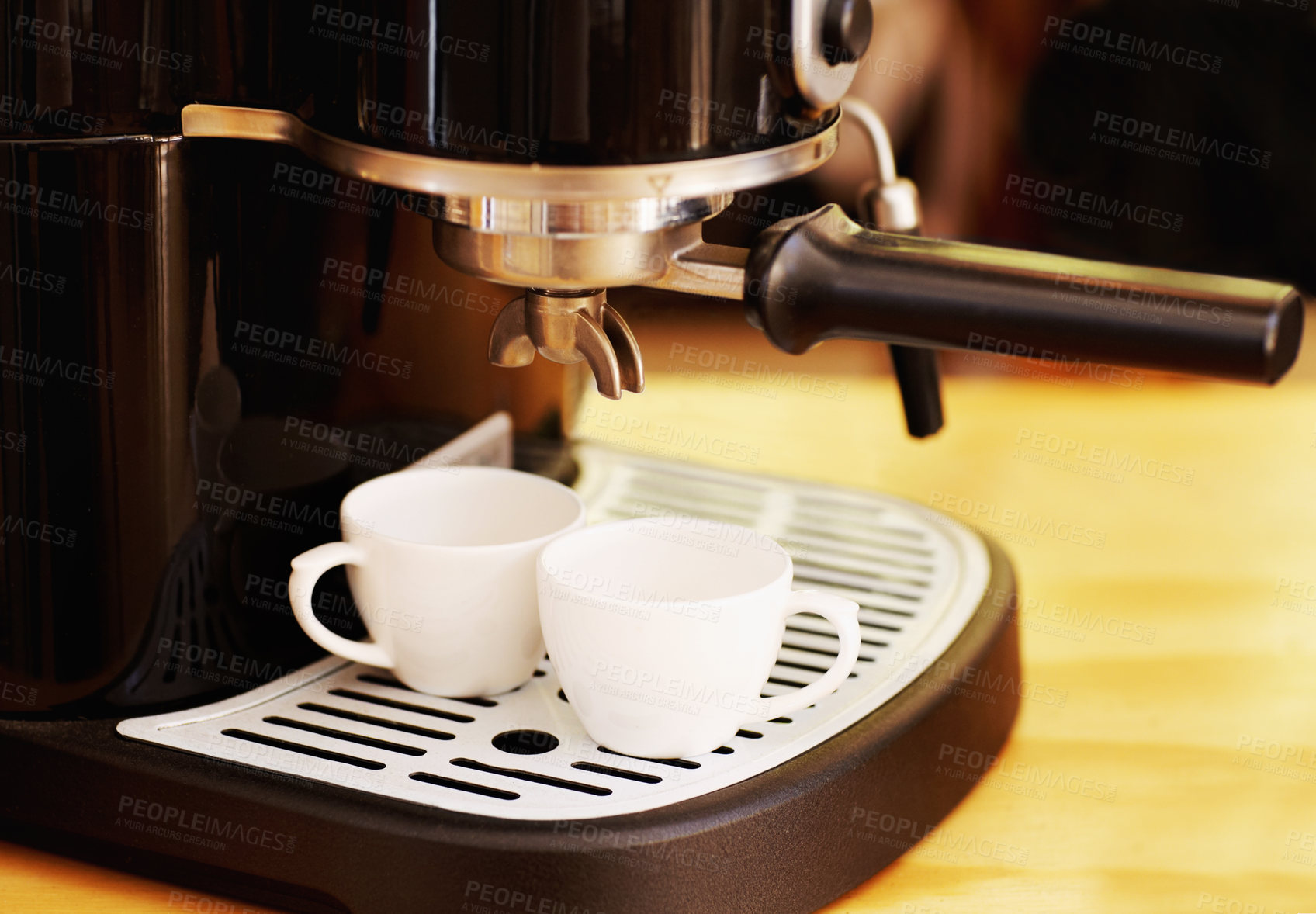Buy stock photo Coffee maker, cups and machine on table in cafe for cappuccino, latte or hot drink. Restaurant, electrical appliance and caffeine cup for making or brewing espresso in retail shop or small business.
