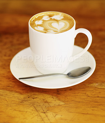 Buy stock photo Latte art, coffee and drink on table in cafe, closeup of hot beverage and artistic heart design with milk foam. Cappuccino, espresso and creative pattern on caffeine liquid brew in a cup on a plate