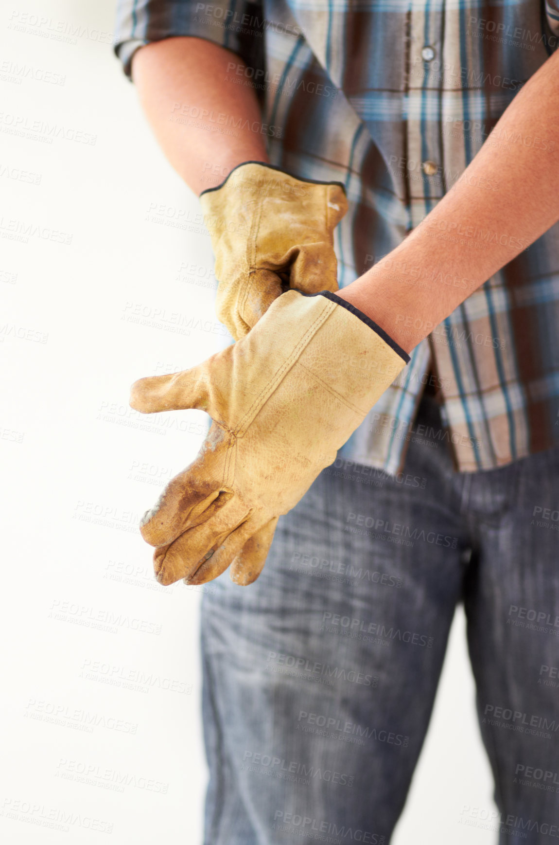Buy stock photo Cropped image of a handyman putting on gloves