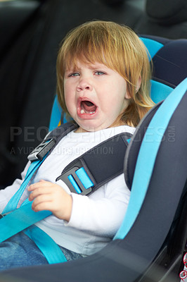 Buy stock photo Sad, crying and portrait of baby in car seat for fear, uncomfortable and travel safety. Security, transportation and journey with upset toddler for vacation trip, frustrated and protection 
