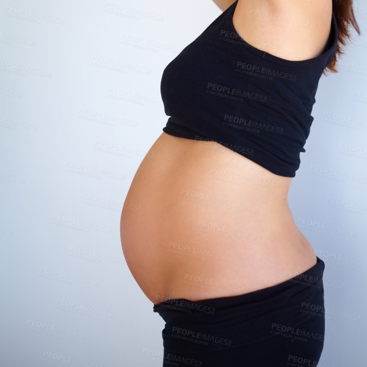 Buy stock photo Side angle view of pregnant woman&#039;s stomach