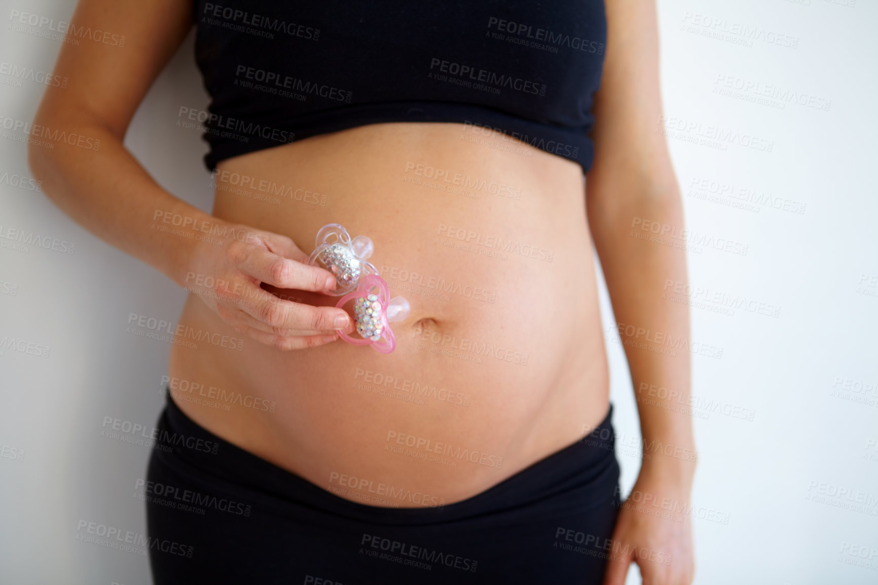 Buy stock photo A close up of a woman&#039;s bare pregnant stomach