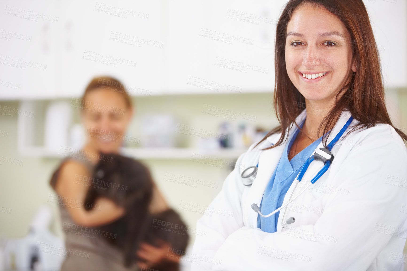 Buy stock photo A portrait of a smiling female vet with a pet owner and her cat int he background