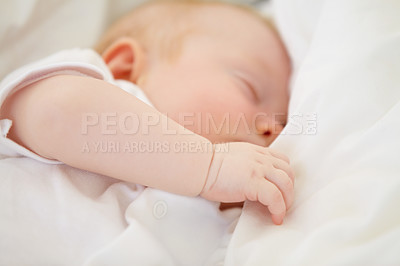 Buy stock photo A baby girl fast asleep in between her white pillows