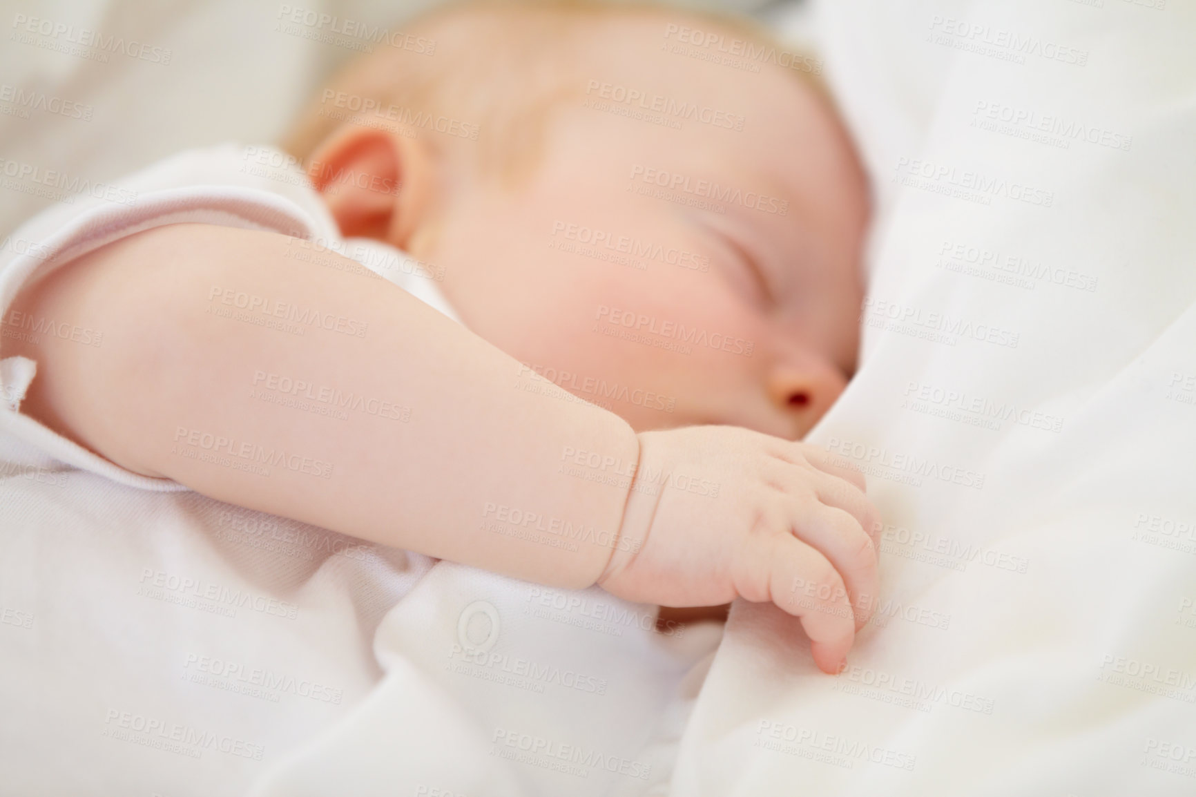 Buy stock photo A baby girl fast asleep in between her white pillows