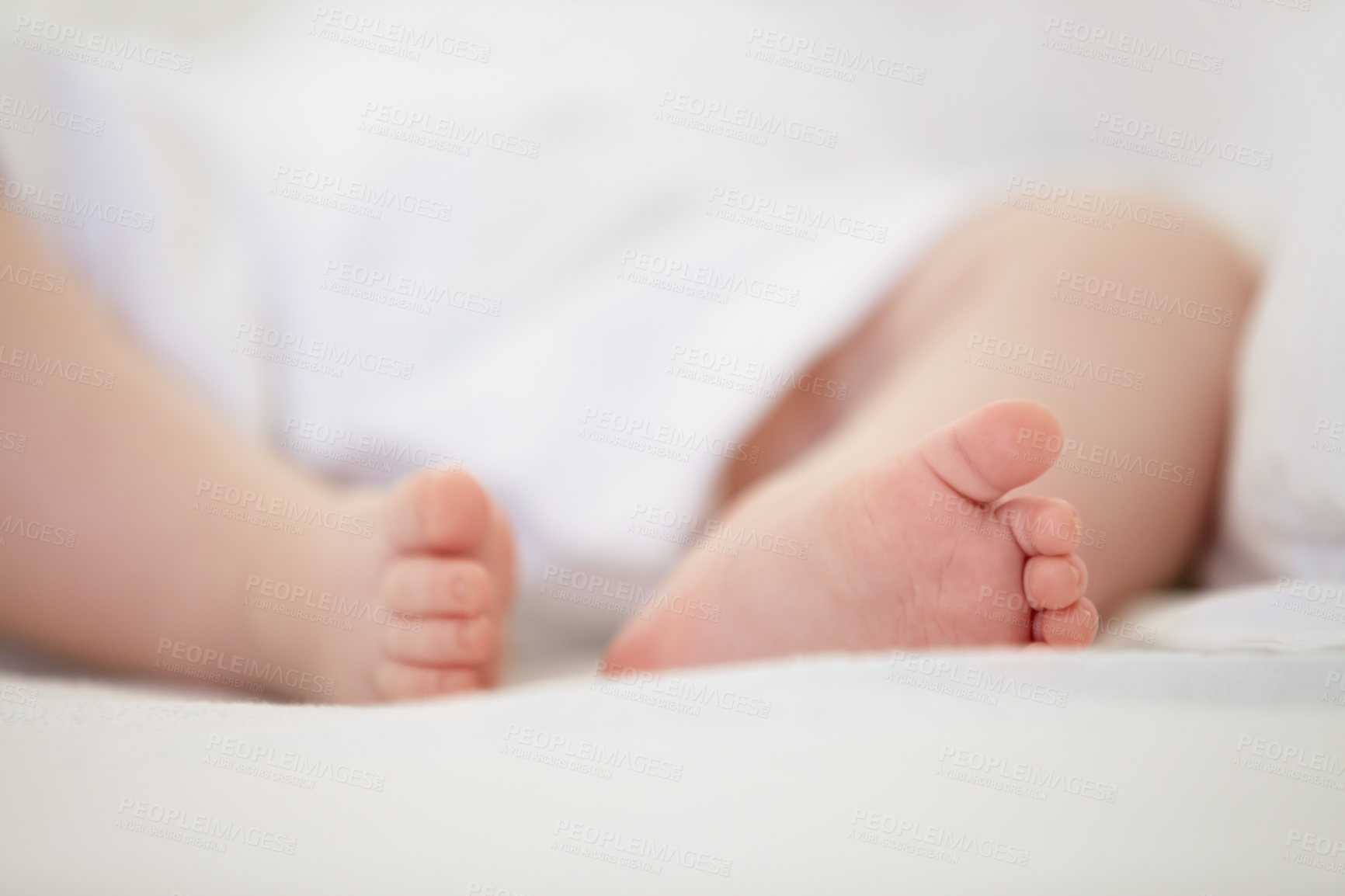Buy stock photo Sleeping, bed and feet of baby in home for dreaming, resting and nap for child development. Family, nursery and closeup of toes of newborn infant in bedroom relax for wellness, health and growth