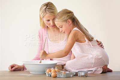 Buy stock photo Bowl, spoon and baking mom, child or family mix ingredients, food or prepare meal, flour or recipe. Home kitchen counter, teaching and kid learning youth development skills, cooking or how to bake