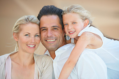 Buy stock photo Portrait, smile and parents with girl, hug and happiness with love, bonding together and relax. Face, mother and father with daughter, embrace and cheerful with a moment, family and care with support