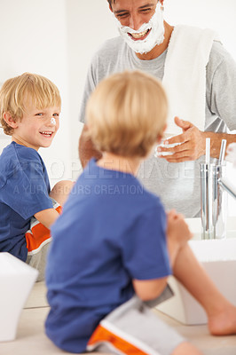 Buy stock photo Shaving, dad and kid with cream on face, mirror and bonding in home with morning smile. Teaching, learning and father with happy son in bathroom for facial shave, clean fun and grooming together.