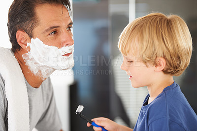 Buy stock photo Help with shaving, father and child with cream on face, smile and bonding in home with morning routine. Teaching, learning and dad with happy son in bathroom for love, clean fun or grooming together