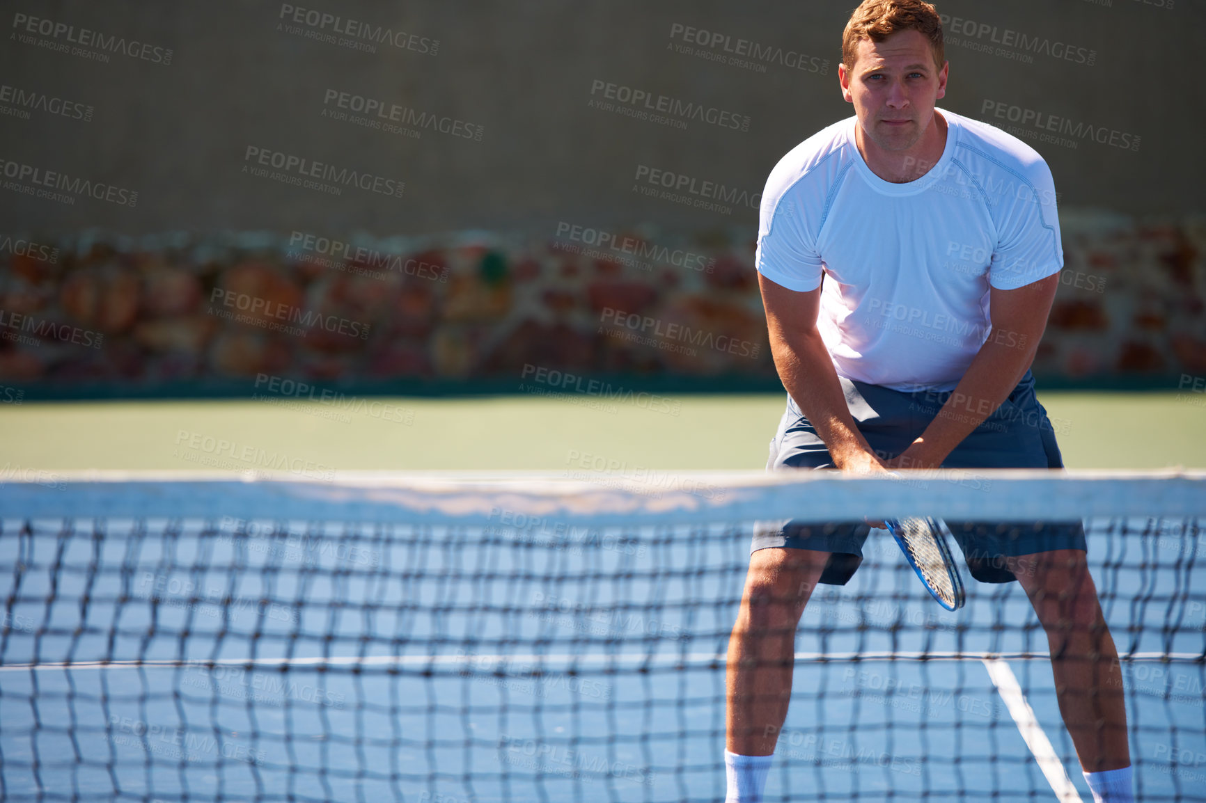 Buy stock photo Shot of a man playing tennis