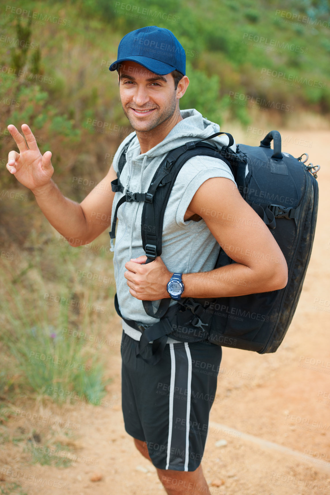 Buy stock photo Portrait, hiking and smile with man in nature for health, trekking and adventure. Travel, explore and journey with person walking in mountain path for backpacking, relax and  wellness vacation