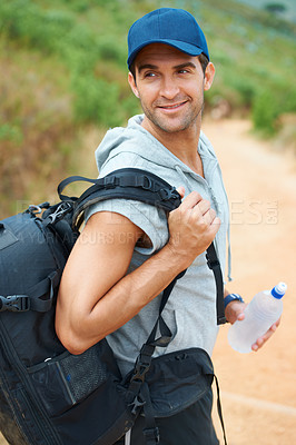 Buy stock photo Water, hiking and smile with man in nature for health, trekking and summer adventure. Travel, explore and journey with person walking in mountain path for backpacking, relax and wellness vacation