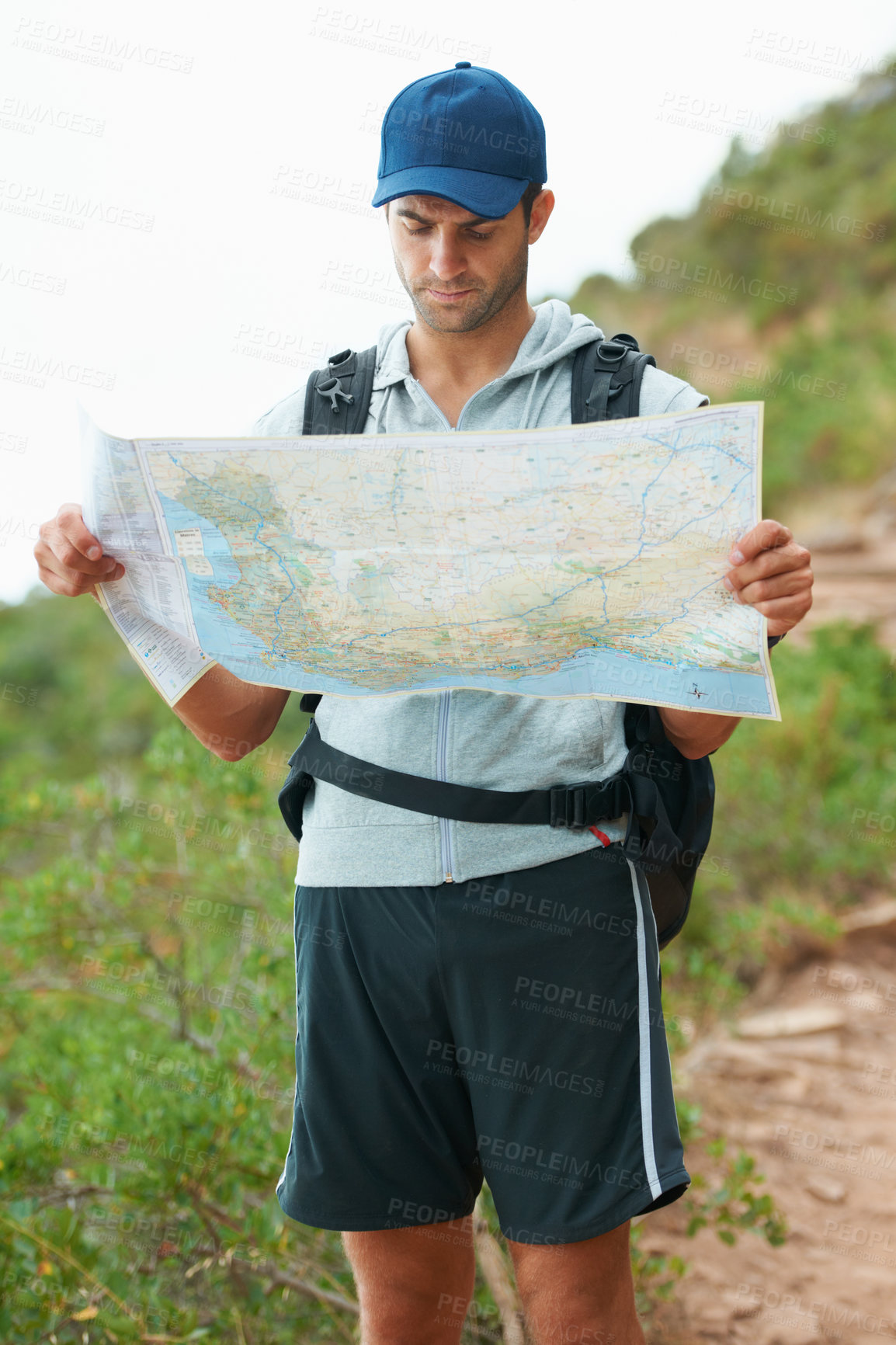 Buy stock photo Man, hiking and map for direction, nature and guide on trail, fitness and exercise on holiday. Male person, lost and documents for information, travel and journey or adventure to forest for cardio