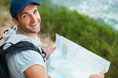 Buy stock photo Man, hiking and map for direction, portrait and guide on trail, fitness and exercise on holiday. Male person, smile and documents for information, travel and journey or adventure in nature for cardio