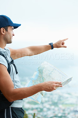 Buy stock photo Map, hiking and man with nature, pointing and adventure with direction, journey and fitness. Person, hiker and guy with wellness, outdoor ot document for location, fresh air and landscape with forest