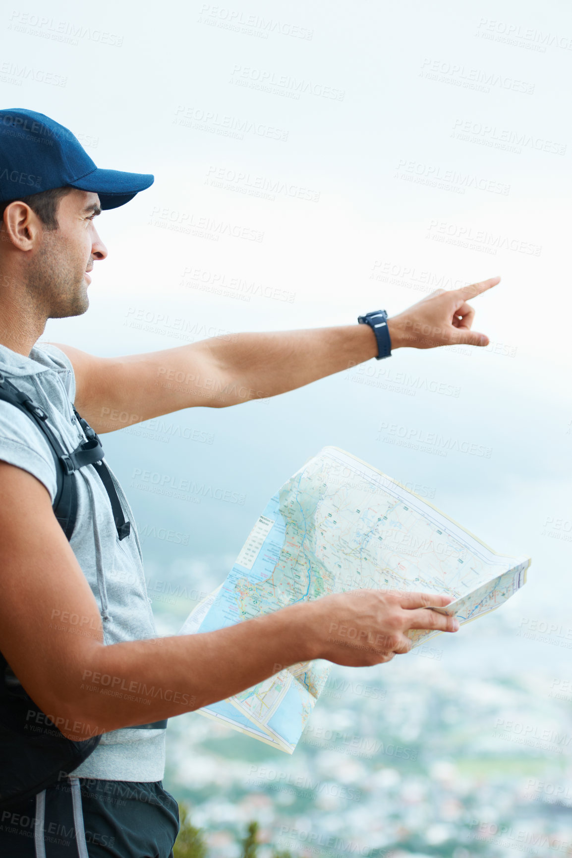 Buy stock photo Map, hiking and man with nature, pointing and adventure with direction, journey and fitness. Person, hiker and guy with wellness, outdoor ot document for location, fresh air and landscape with forest