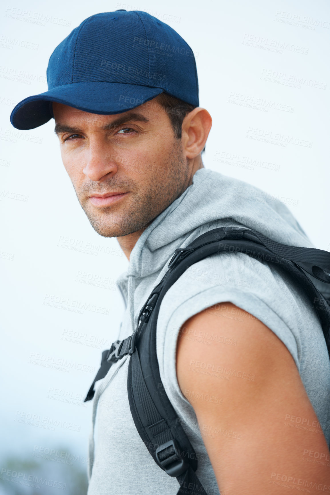 Buy stock photo Portrait, hiking and man with nature, workout and exercise with wellness, fresh air or challenge. Person, hiker or guy with backpack, hobby or activity with freedom, training or endurance with face
