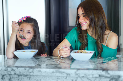 Buy stock photo Young mother, breakfast portrait and child and happy girl or young people eating cereal, morning food or meal. Home, kids and family or parent enjoy bonding time together at kitchen table