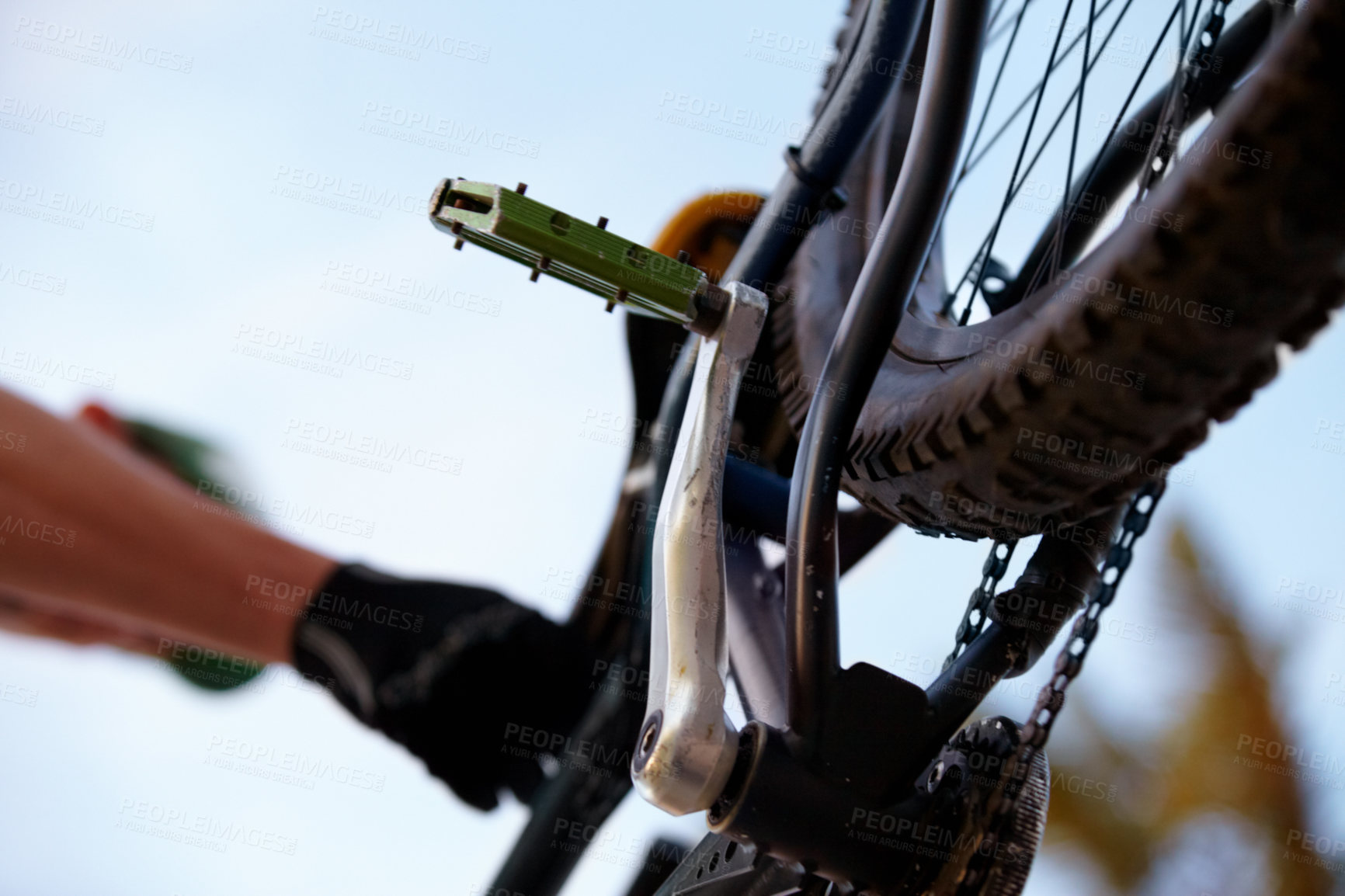 Buy stock photo Closeup, bicycle and low angle with wheel, chain and pedal for sport, fitness and workout in nature. Below mountain bike, tire and outdoor for race, sports adventure or eco friendly transportation