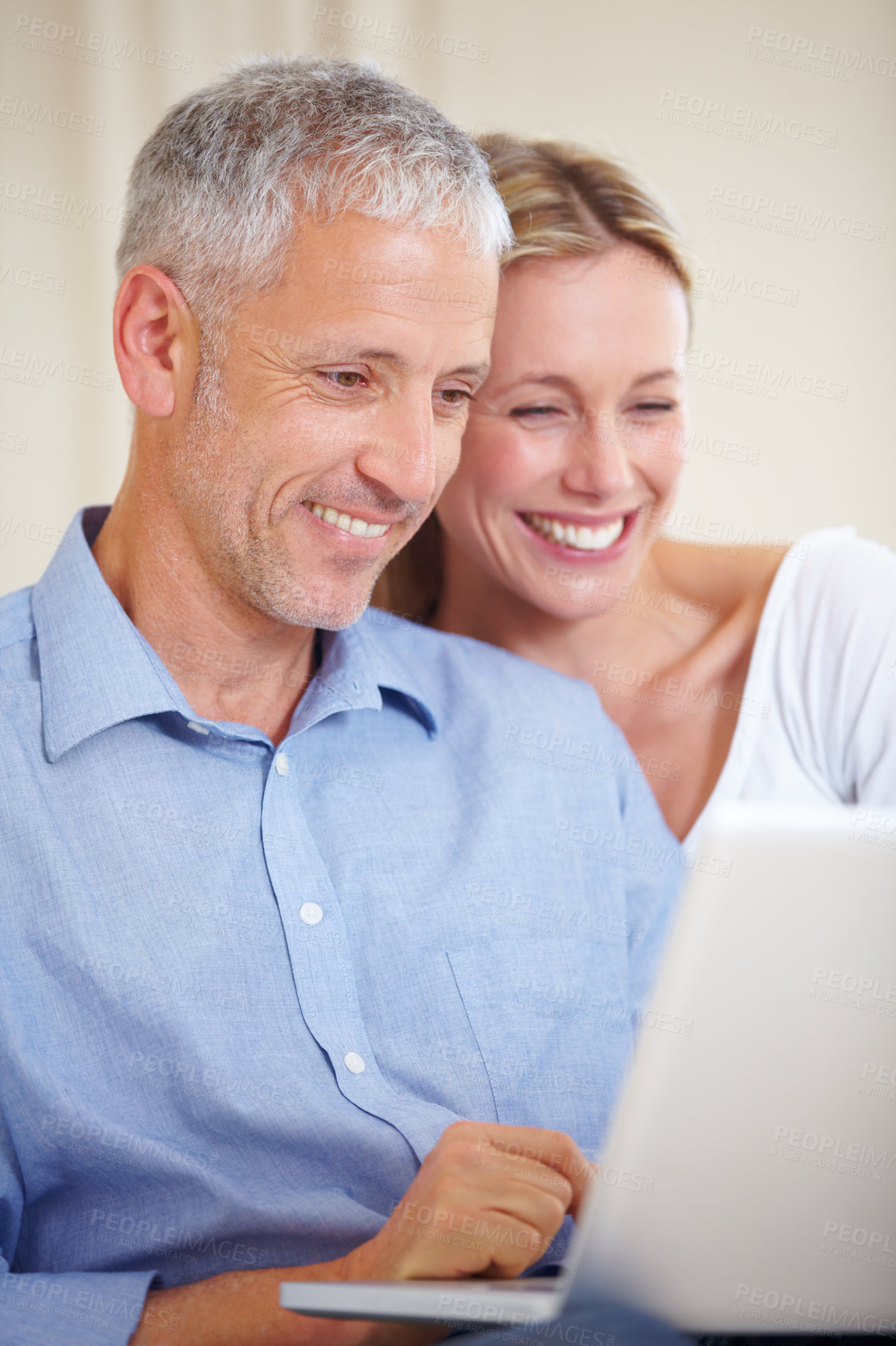 Buy stock photo Mature couple, laptop and smiling with video call, conversation and living room couch. Social media, technology and communication with family, man and woman with connection, streaming and happy
