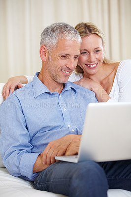 Buy stock photo Mature couple, laptop and watching with laugh, conversation and living room couch. Social media, technology and communication with family, man and woman with connection, streaming and happy
