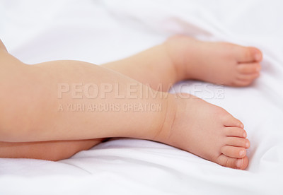 Buy stock photo Feet, baby and legs of kid on bed for sleep, calm break and relax in nursery room at home. Closeup, foot and toes of tired young child asleep for newborn development, healthy childhood growth or rest