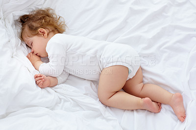 Buy stock photo An adorable baby sleeping on the bed