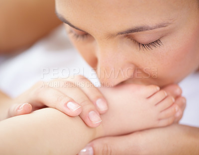 Buy stock photo Mom, baby and kiss feet of child for love, care and relax in nursery room at home. Face, mother and closeup of foot of young kid for newborn development, healthy childhood growth or affection of bond