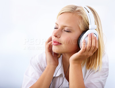 Buy stock photo Woman, relax and headphones for music on a white background for audio streaming service and mental health podcast. Student or calm person listening to music with dream, sleeping or peace in studio