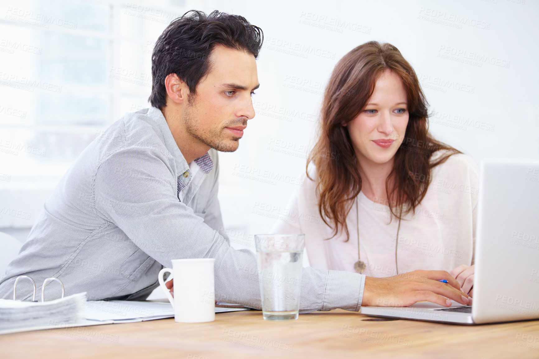 Buy stock photo Laptop, collaboration and business people with teamwork, planning and online support in office meeting. Woman, man or partner feedback, editing or working on computer with project management software