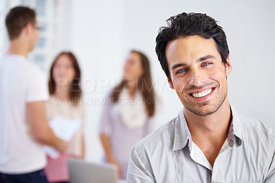 Buy stock photo Happy, work and portrait of a man in an office with business people for commitment and our vision. Smile, working and face of a corporate employee at a company with workers at a professional agency