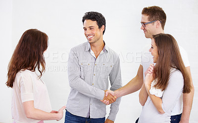 Buy stock photo Happy business people, handshake and introduction for teamwork, success and b2b agreement, acquisition deal or praise. Employees shaking hands for partnership, collaboration and welcome to onboarding
