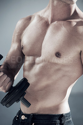 Buy stock photo a cropped shot of a muscular male with a bare chest lifting weights