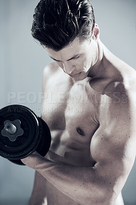 Buy stock photo Fitness, muscles and man with dumbbell weight in a studio for bodybuilding workout, exercise or training. Sports, health and young male athlete from Canada with equipment isolated by gray background.