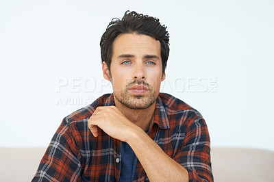 Buy stock photo Man, portrait or serious on sofa for relax, peace and calm expression in living room of apartment or home. Person, face and thinking or ideas on couch in lounge for question, rest or shirt on weekend