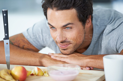 Buy stock photo Man, fruit and kitchen diet at breakfast or health nutrition, eating vitality or banana for protein. Male person, yogurt and apple wellness meal or hungry vegan preparation, fiber as morning vitamins