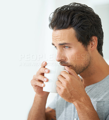 Buy stock photo Wake up, morning and a man drinking coffee from a mug in his home alone on the weekend to relax. Face, thinking and caffeine with a handsome young male model enjoying a fresh beverage in his house