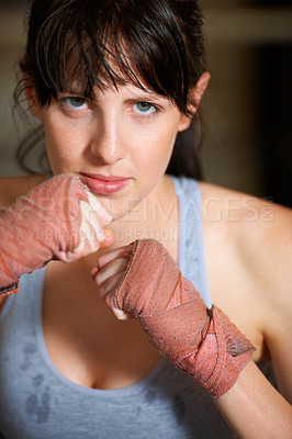 Buy stock photo Boxing, hands and portrait of woman with confidence, power and fearless training challenge in gym. Strong body, muscle and face of boxer, athlete or girl with fist up for fitness in competition fight