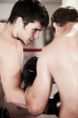 Buy stock photo Man, boxing and fight in ring at gym for workout, exercise or indoor self defense training together. Male person, boxer or sports trainer fighting with sparing partner in competition or practice